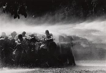 BOB ADELMAN (1930-2016) Civil rights demonstrators are sprayed with water in Birmingham, Alabama.                                                